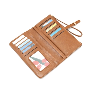 Brown faux leather long wallet with multiple card slots and wrist strap for women