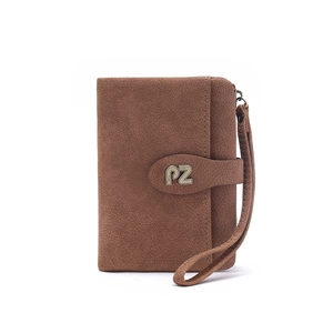 Detailed shot of brown matte texture wallet with metal logo and leather wrist strap