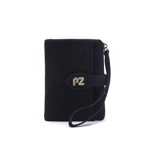 Detail view of black matte wristlet wallet featuring PZ metal buckle and wrist strap