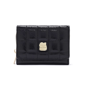 Detail of black quilted PU leather wallet with gold metal logo and smooth zipper texture