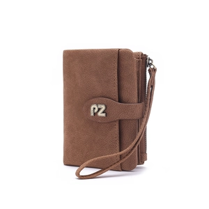 Macro view of brown matte leather short wallet with bronze zipper and logo buckle