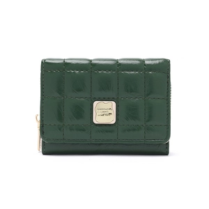Detail of dark green quilted faux leather wallet with square stitching and gold logo