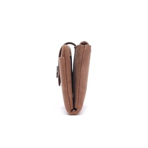 Side view of brown textured leather wallet showing multi-layered compartments and stitching