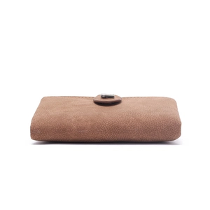 Detail view of brown leather wallet featuring a matte texture and rectangular metal clasp