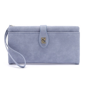 Detail of light blue faux suede wallet featuring metal PZ logo and braided wrist strap