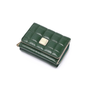 Detail of dark green quilted PU leather wallet with golden metal logo and zip closure