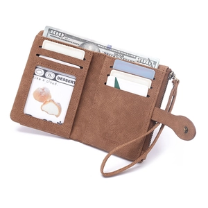 Macro view of short brown frosted leather wallet showing card slots and money compartment