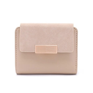 Close-up of rose gold logo metal clasp on a dual-texture nude pink leather wallet
