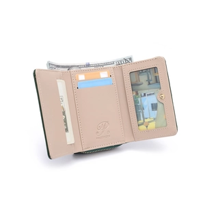 Detail of unfolded dark green PU leather wallet with card slots and clear ID window