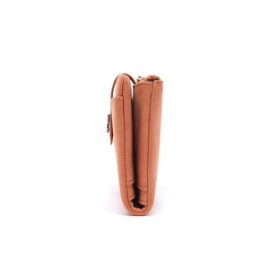 Side view detail of brown matte long wallet showing layered compartments and fine stitching