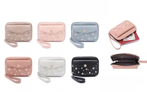 Detail view of large capacity floral passport wallet in six elegant color options