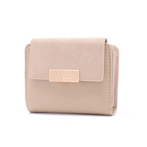 Detail of minimalist short wallet showing matte suede flap and rose gold metal hardware