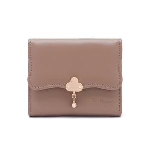 Close-up of small mocha wallet featuring wave edges and a golden cloud-shaped metal clasp