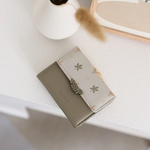 Olive green leaf clasp wallet with pebble texture leather and leaf pattern print