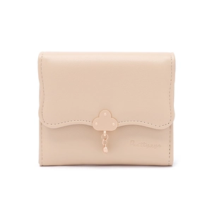 Detail of scalloped edge short wallet with cloud buckle and decorative pendant charm