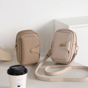 Detail of lychee pattern PU leather phone crossbody bags with metal buckle and zipper
