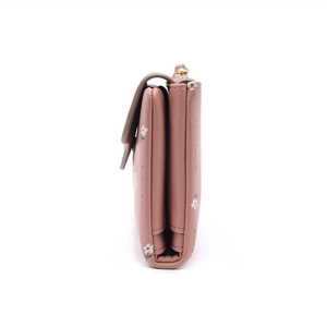 Side view of folded Prettyzy mauve pink leather wallet showing floral print and thickness
