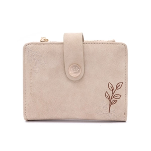 Detailed view of beige faux leather wallet with plant leaf embroidery and snap closure
