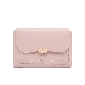 Close-up of pink floral wallet with gold flower clasp and textured faux leather finish