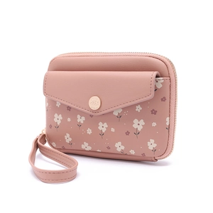 Detailed side view of floral pink leather wallet with gold zipper and wrist strap