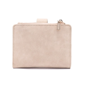 Detail of light beige matte leather wallet featuring a golden zipper with engraved logo