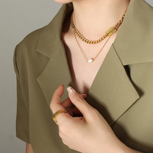 Hip hop layered necklace with gold Cuban chain, pearl pendant and textured ring set