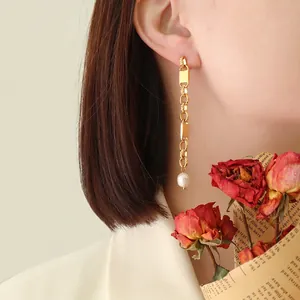 French vintage style gold drop earrings with geometric chain and white freshwater pearls