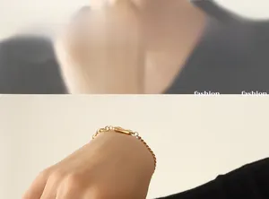 Detail of a gold-plated Cuban link bracelet featuring a unique B letter geometric charm