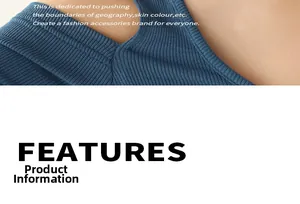Detailed close-up of blue ribbed knit texture with unique cutout shoulder design