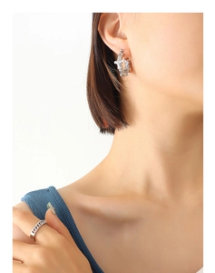 Detail of French style hammered U-shape pearl earrings and Cuban link chain ring set