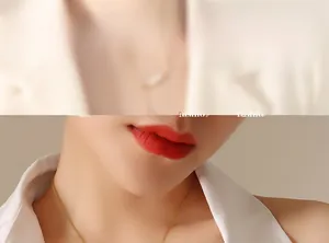 Close-up of a minimalist gold thin link chain necklace worn on a model's neck