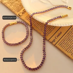 Elegant gold-plated jewelry set with purple oval zircon necklace and bracelet on a tray