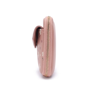 Detail view of pink floral mini crossbody bag with golden zipper and leather texture