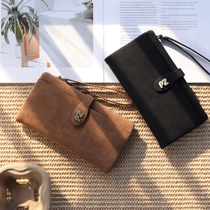 Close-up of matte PU leather wallet with PZ metal logo and convenient hand strap