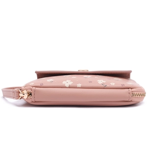 Detail of pink floral faux leather passport holder with high-quality gold zipper and strap