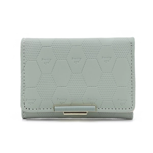 Detail of mint green PU leather wallet with geometric hexagonal embossing and metal clasp