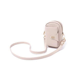 Detail of beige litchi grain leather crossbody phone bag with golden metal buckle hardware