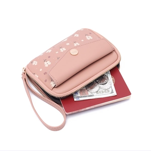 Pink floral leather passport wallet with multi-functional zipper and wristlet strap