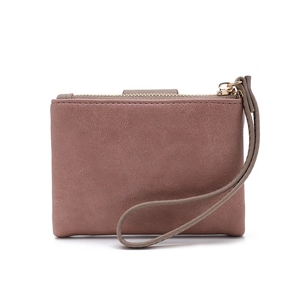 Detail of grey-pink PU leather coin purse with golden zipper and matching wrist strap