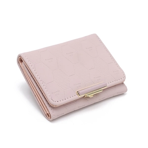 Detail of pink bi-fold wallet featuring hexagonal embossing and gold snap closure