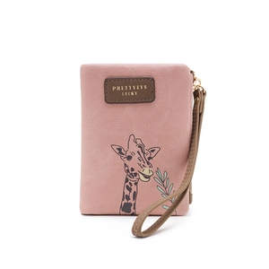 Close-up of pink PU leather giraffe wallet featuring an embossed label and wristlet strap