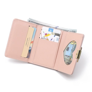 Detailed interior of pink trifold wallet showing card slots and photo window