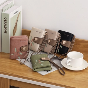 Short PU leather wallets with leaf embroidery and magnetic clasp in various colors