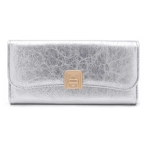 Detailed view of silver crinkle textured wallet with gold geometric metal hardware