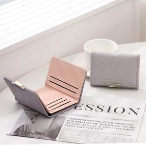 Diamond quilted tri-fold wallet for women with card slots in grey and pink leather
