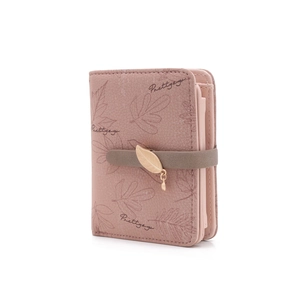 Close-up of pink PU leather wallet with leaf print, card slots and gold leaf pendant