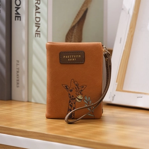 Detailed view of caramel PU leather wallet with giraffe motif and zip closure strap