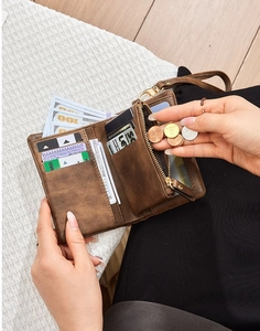 Brown RFID wallet showing multiple card slots, bill compartment and zippered pocket