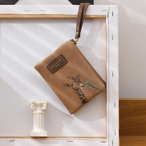 Detailed view of a brown PU leather wallet featuring a cute giraffe print and logo strap
