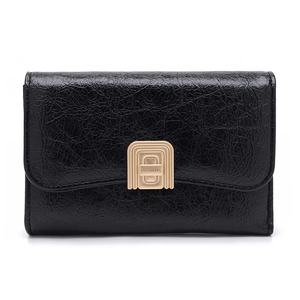 Detail of black glossy crinkle leather wallet featuring a golden rectangle metal clasp